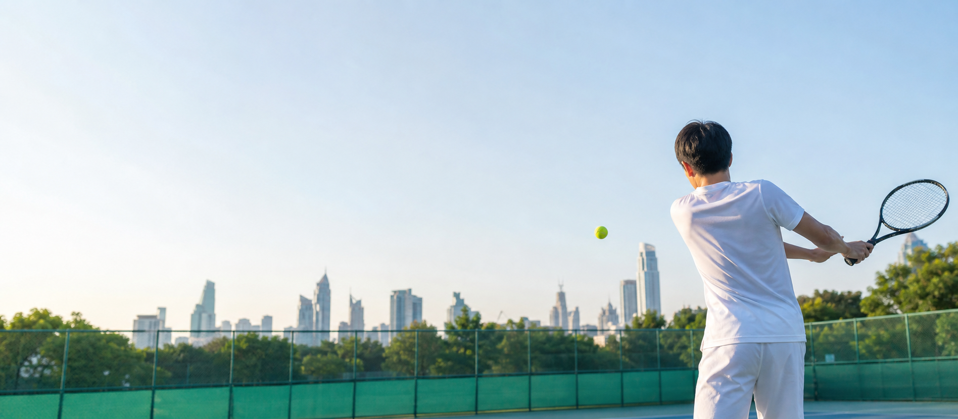 Tennis player on an outdoor court in Bangkok